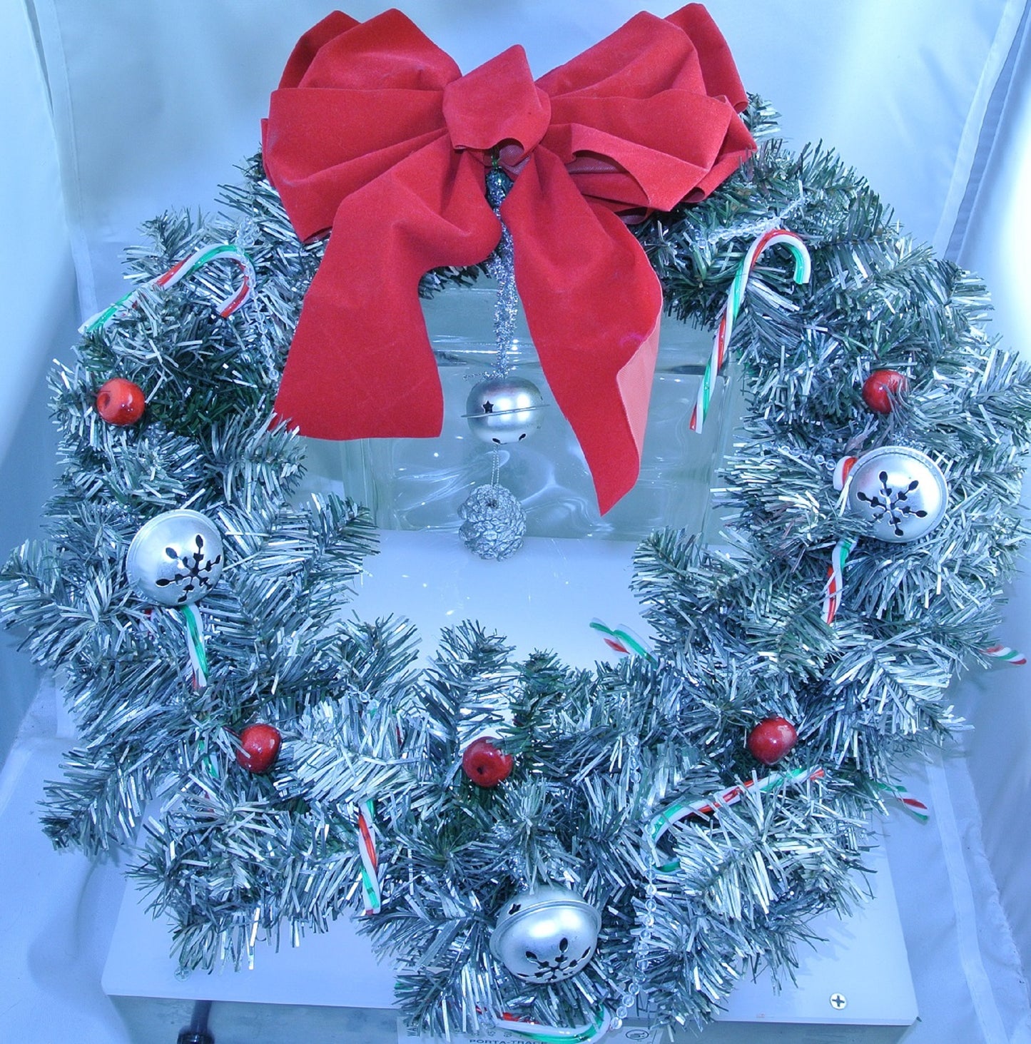 CHRISTMAS WREATH SILVER STAR BELLS RED CRANBERRIES RED WHITE GREEN CANDY CANES SILVER PINECONE CLEAR CRYSTAL WRAP RED BOW STARR WILDE STEAMPUNK FORTRESS