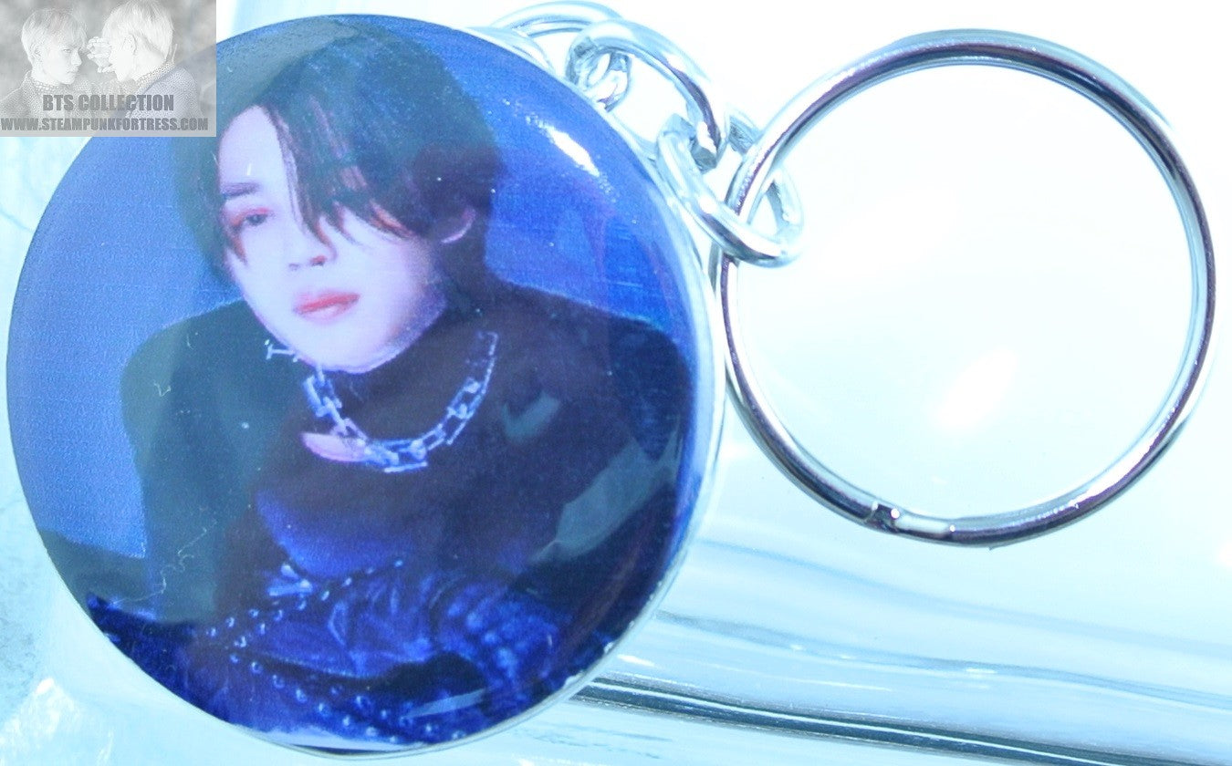 BTS BUTTON KEYCHAIN KEYRING PARK JIMIN ID CHAOS BLACK LYING ON LIGHTBOX KEY CHAIN RING