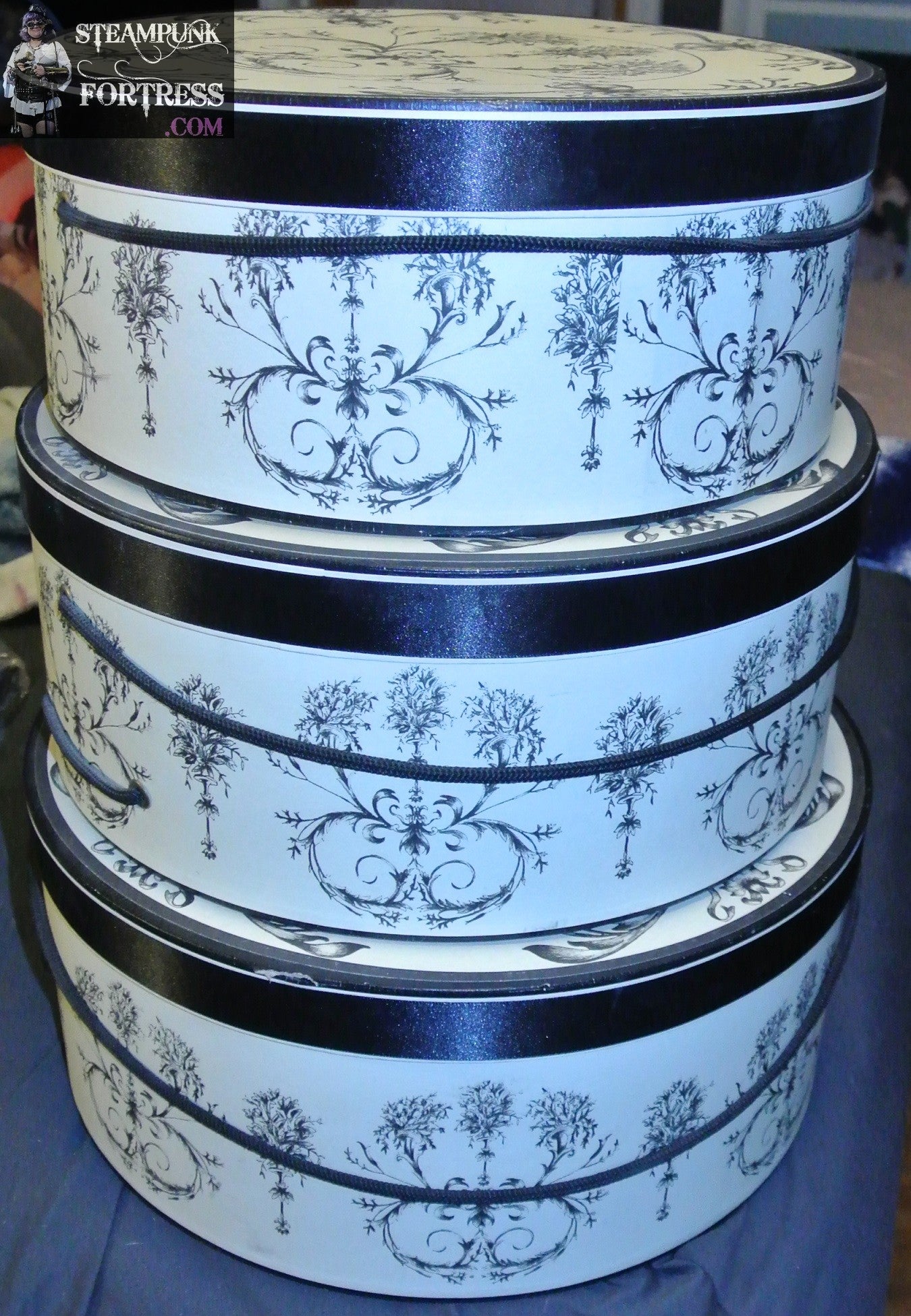 HAT BOXES ROUND SET OF 3 TAN BLACK TOILE PATTERN BLACK ROPE HANDLE ON EACH 12" 13"AND 14"