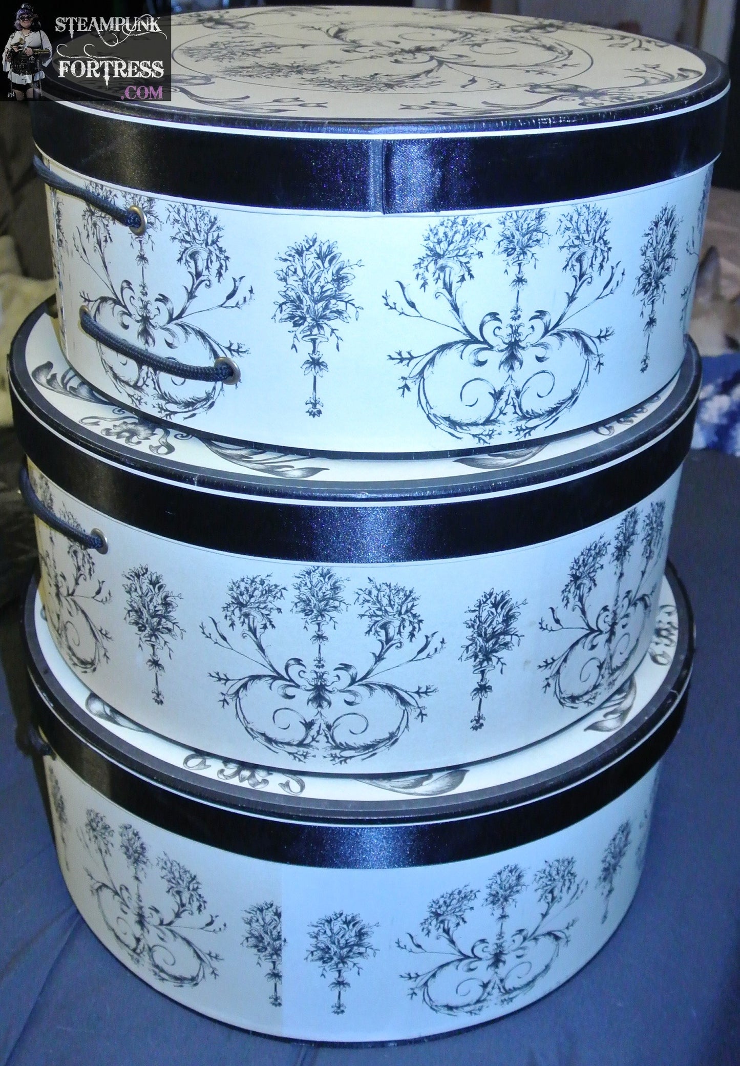 HAT BOXES ROUND SET OF 3 TAN BLACK TOILE PATTERN BLACK ROPE HANDLE ON EACH 12" 13"AND 14"