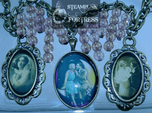 BRASS VINTAGE LADIES COUPLE IN MOON 2 BRASS FANCY EDGE COUPLE LACE LADY PINK BEADS NECKLACE SET AVAILABLE STARR WILDE STEAMPUNK FORTRESS