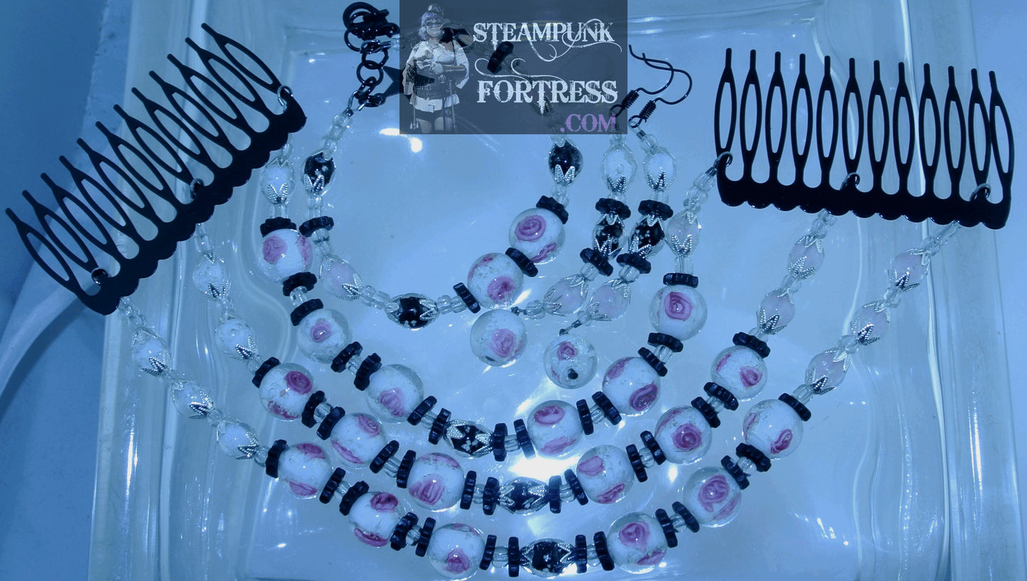GLOW IN THE DARK CLEAR BEADS WHITE PINK GLOW ROSES WHITE PINK BLACK GLOW BEADS BLACK CERAMIC GEARS SILVER BEAD CAPS GLOW IN THE DARK WIRE BRACELET SET AVAILABLE STARR WILDE STEAMPUNK FORTRESS