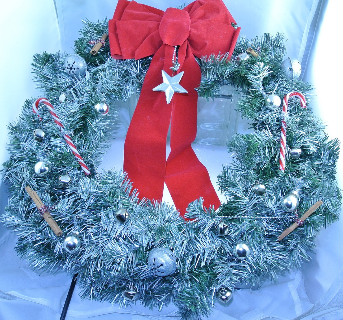 CHRISTMAS WREATH SILVER RED WHITE CANDY CANES SILVER STAR SILVER BELLS SILVER GLASS ORNAMENTS GLITTER SILVER STAR BELLS SILVER WRAP CINNAMON STICKS RED BOW STARR WILDE STEAMPUNK FORTRESS
